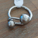 Bague Aras en acier inoxydable argenté avec design double boule entrelacées