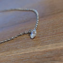 Collier Tulcan argenté – détail pendentif brillant libre et taillé, chaînette fine acier inoxydable