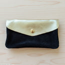 Portefeuille Tomarbi bi-matière coloris noir - Nubuck et cuir doré