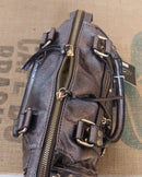 Sac Azilal simili cuir brillant métallisé bronze vue du dessus — fermeture zip dorée, double poignée courte, 28 cm de largeur — ineva
