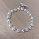 Bracelet Modo – Perles Nacrées Blanches & Boules Acier Élastique